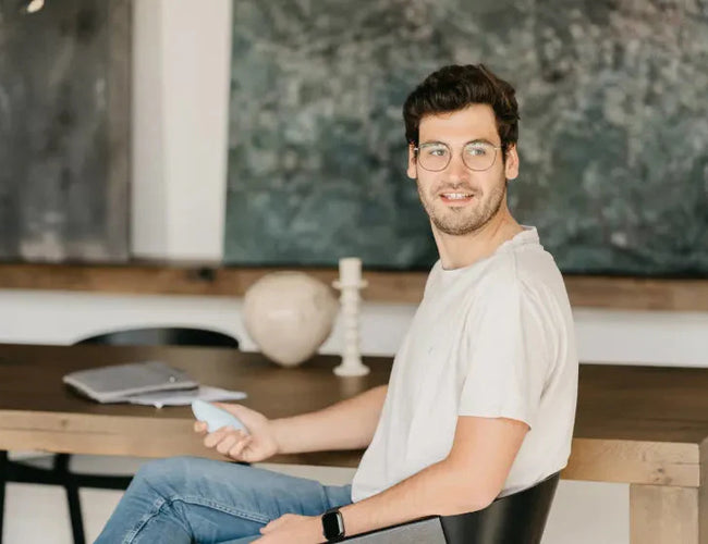 man sits at desk and does breathwork