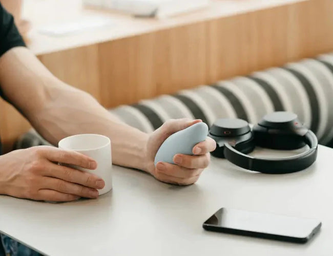 man holding breathwork tool